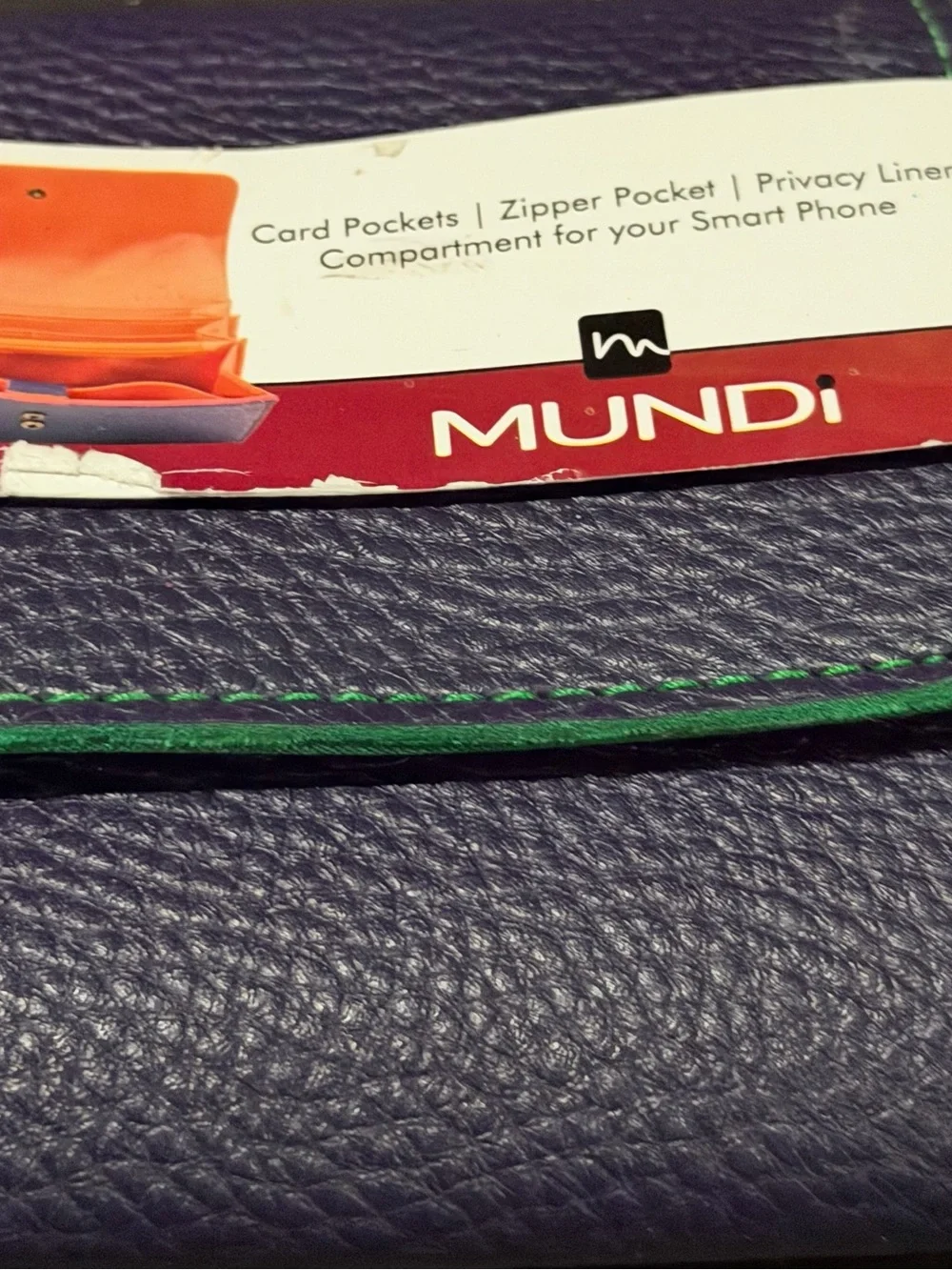 mundi tag worn
